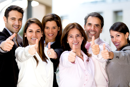 Successful business people with thumbs up and smiling